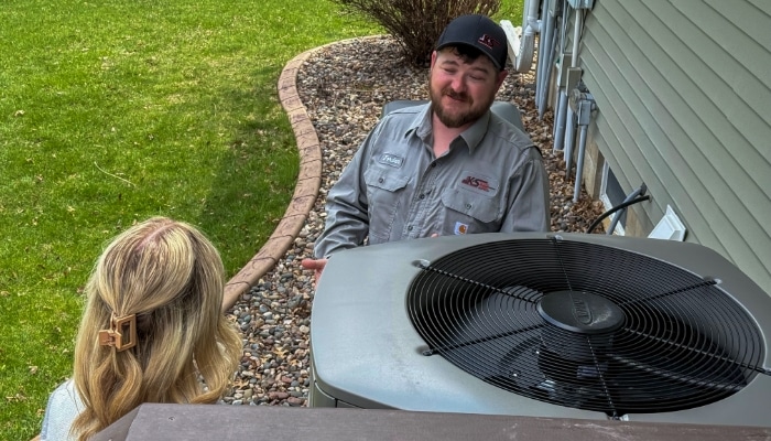 Technician And Customer Outside With Hvac Condensor