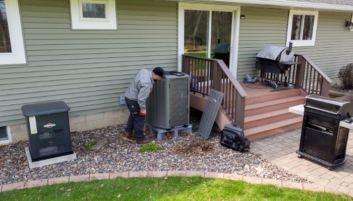 Technician Performing Maintenance On Lennox Unit