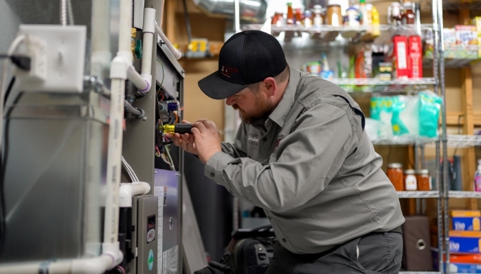 Technician Working On Air Handler