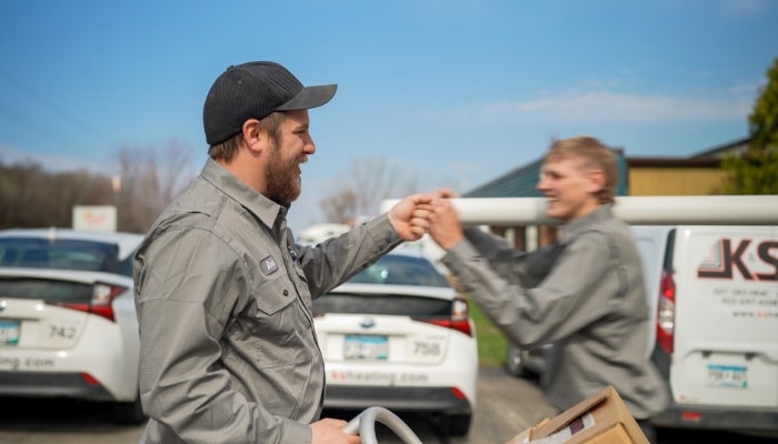 Two Employees Fist Bumping