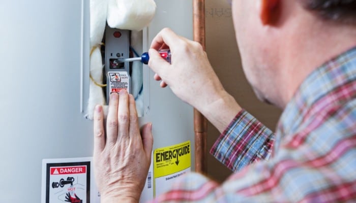 Water Heater Technician At Work Water Heater Technician At Work